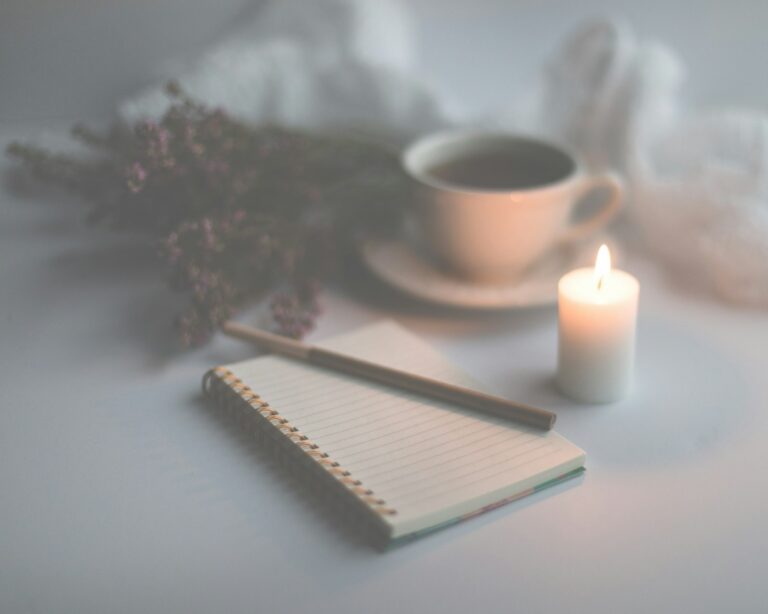 Candle and notebook